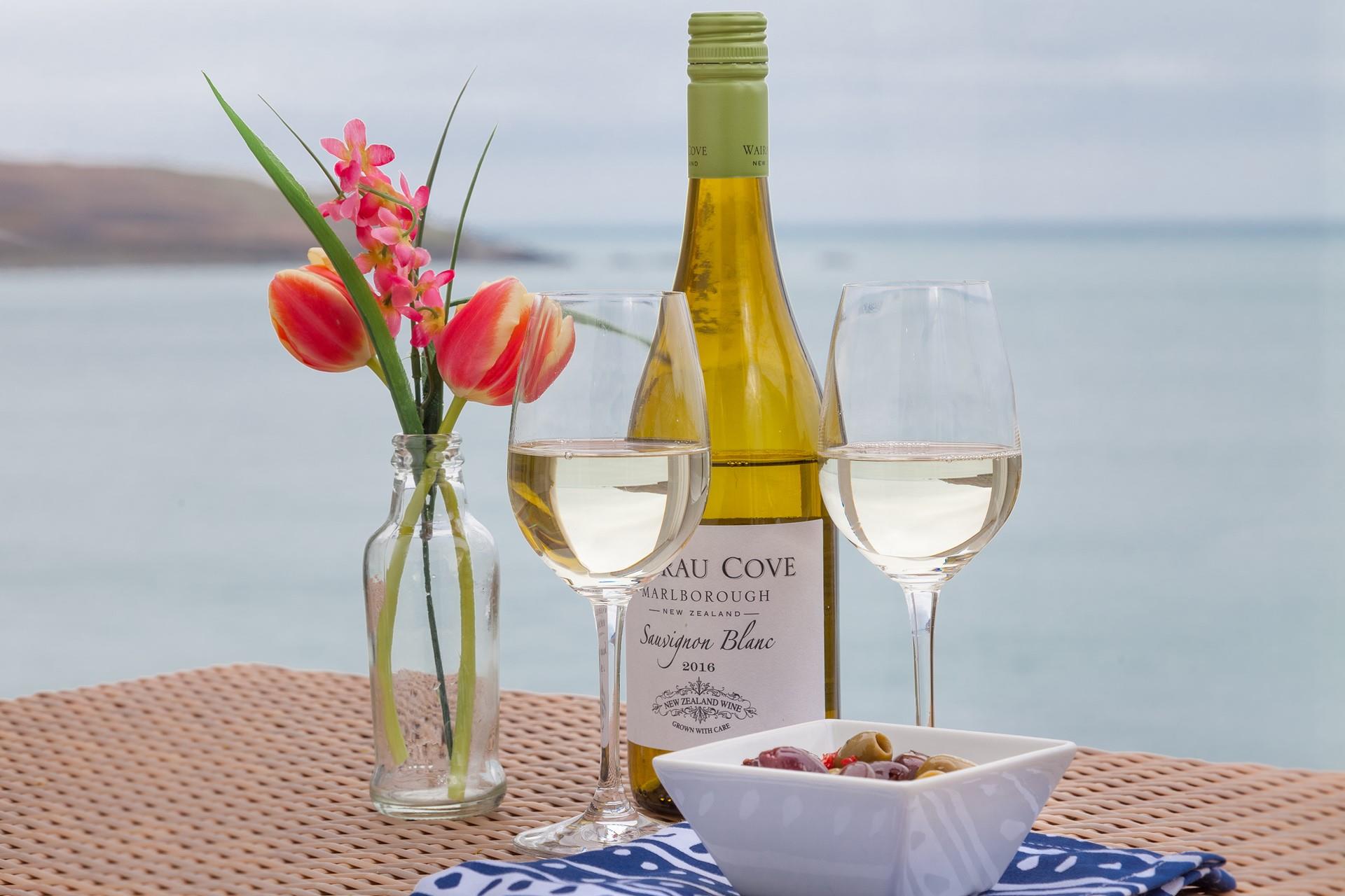 Buy a bottle of wine in town and sip it on your balcony soaking up the evening sun.