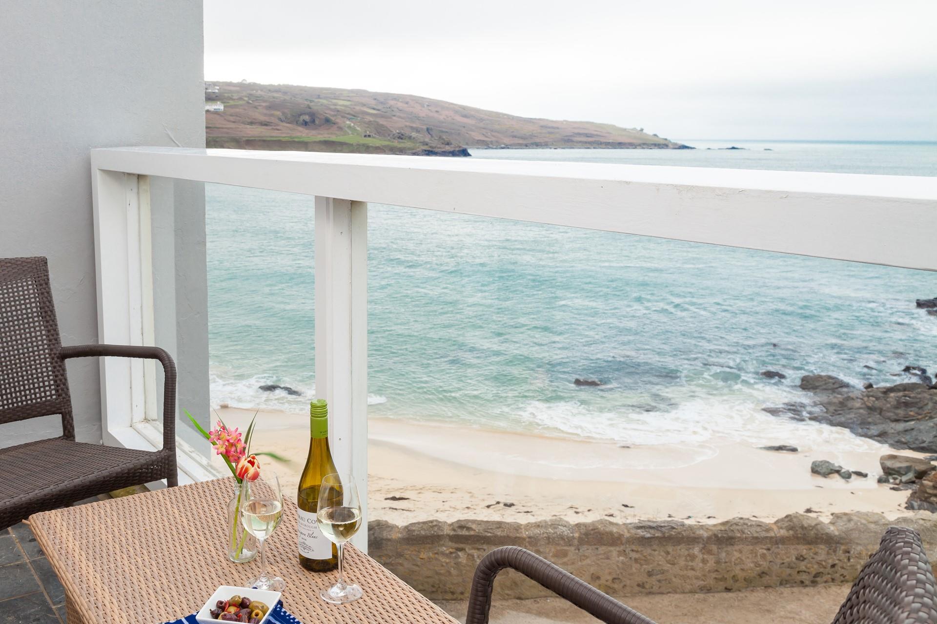 Open a bottle of wine and take in the fantastic sea views from the balcony.