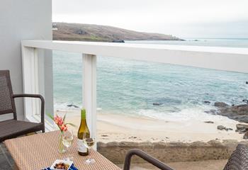 Open a bottle of wine and take in the fantastic sea views from the balcony.