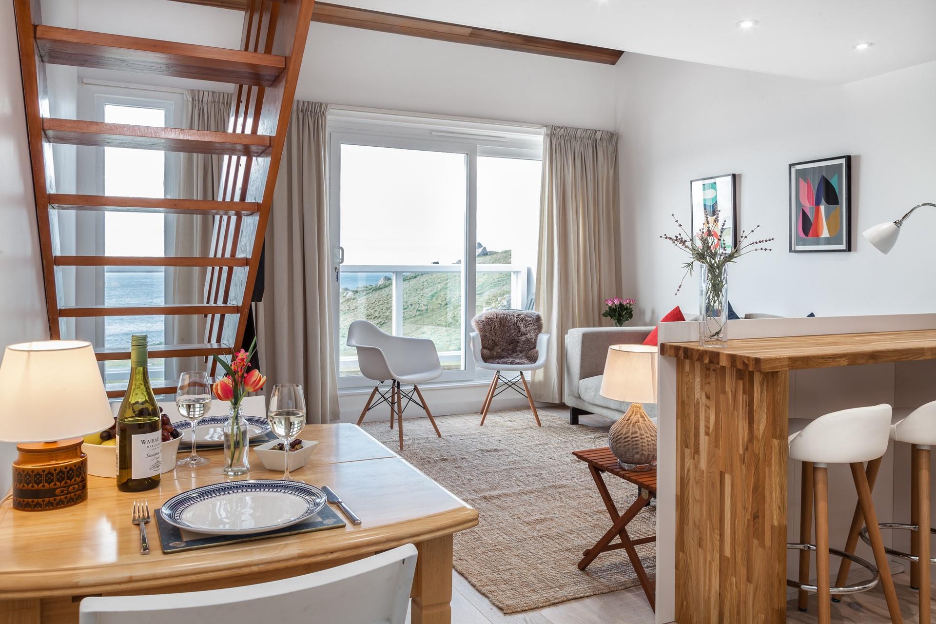 Relaxing in your sitting room watching the waves roll onto the beach.