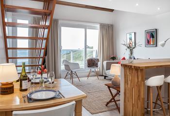 Relaxing in your sitting room watching the waves roll onto the beach.