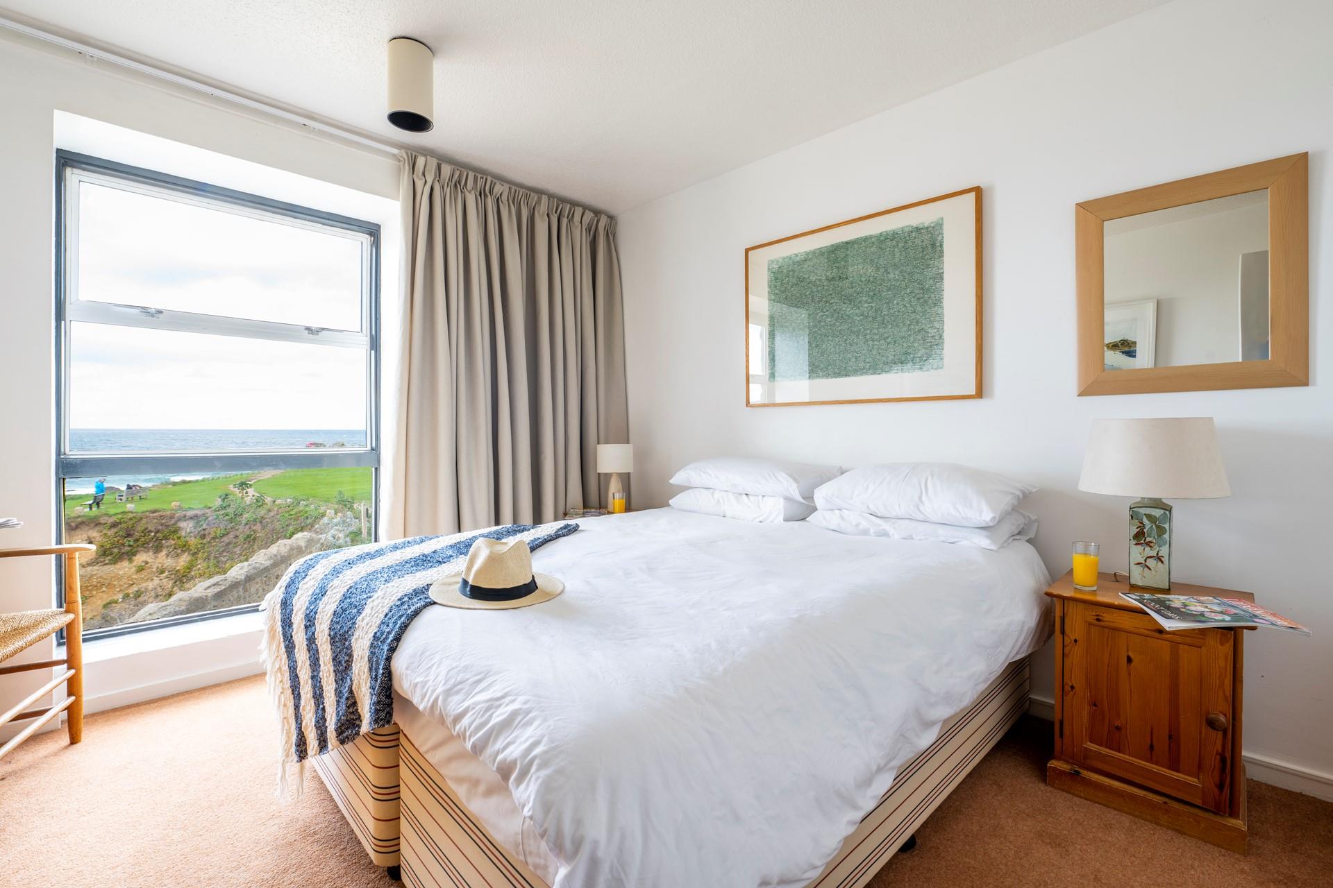 Bedroom 2 has zip and link beds so can be made up as twin or double. Views over the beach and the Island.