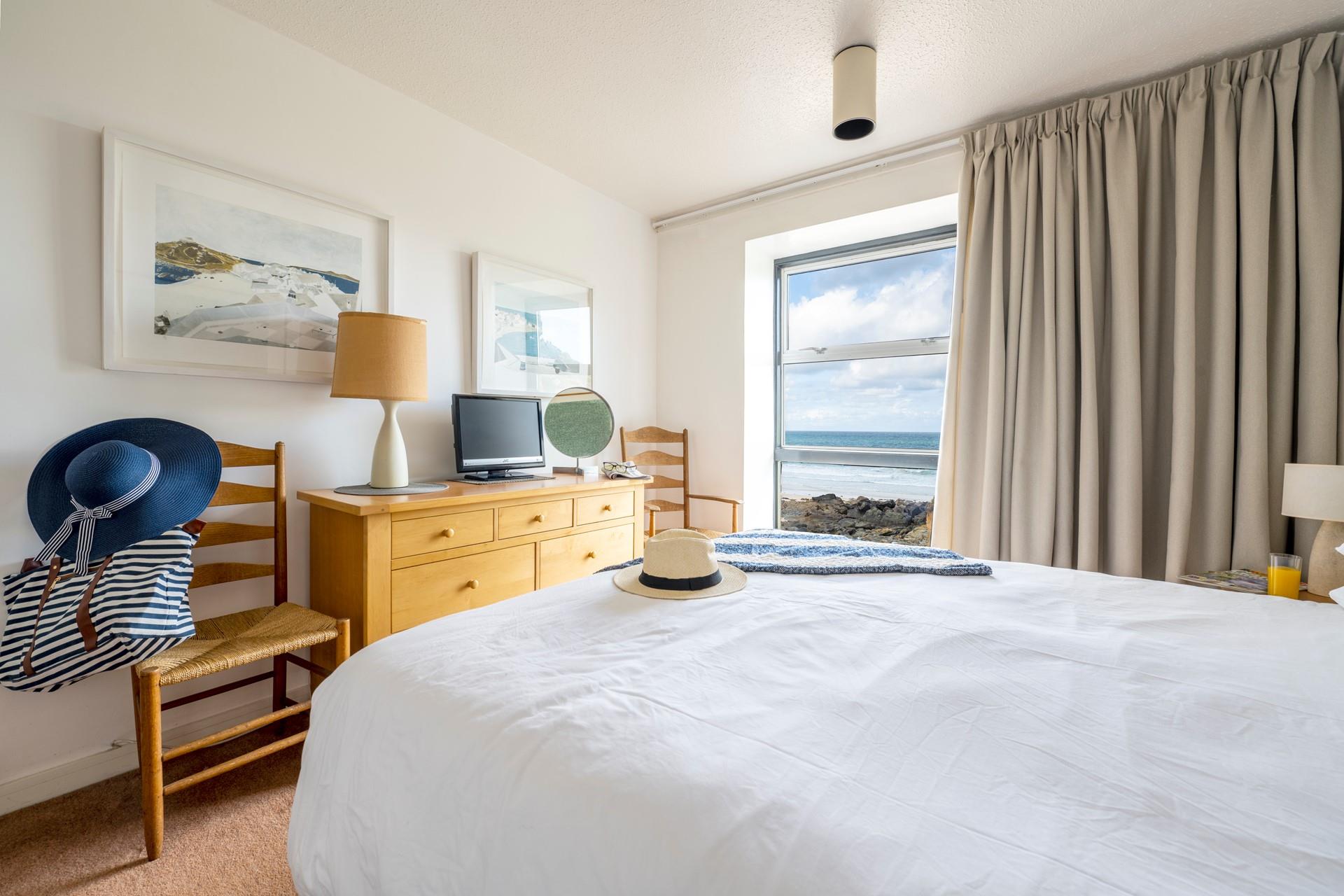 Wake up to the view of the sun rising over Porthmeor beach.