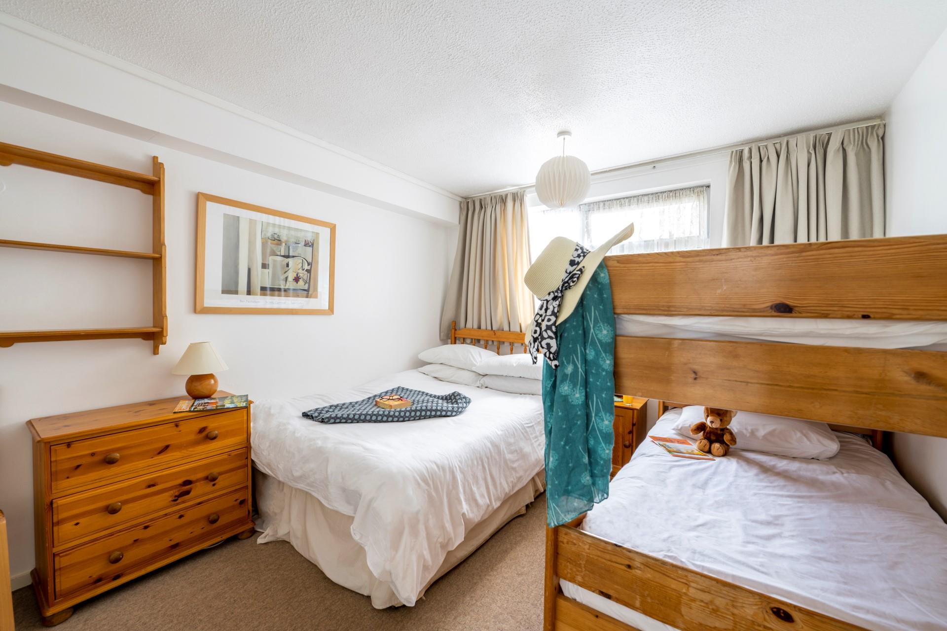 Bedroom 3 has a double bed and bunks.