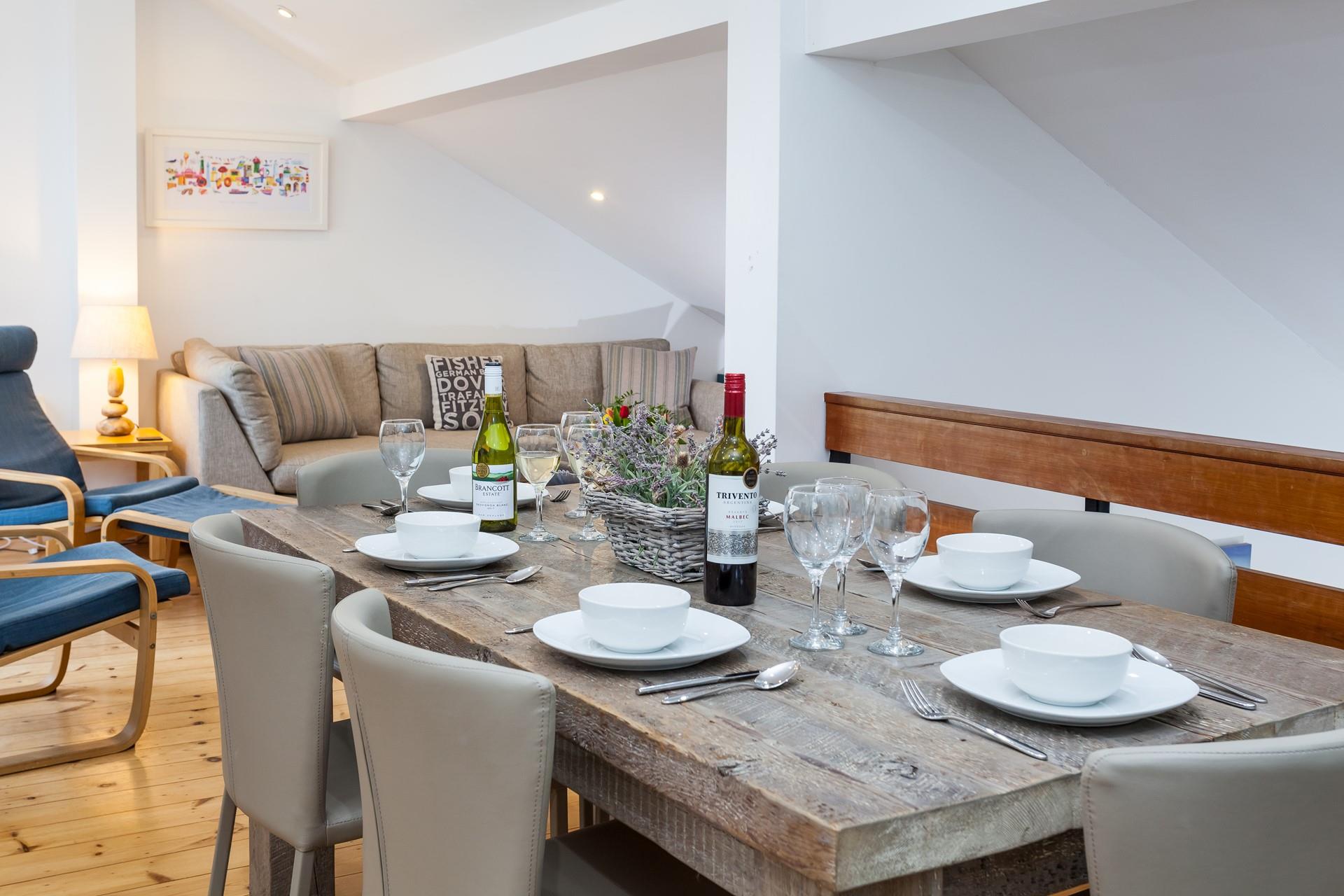 Gather around the table to enjoy a meal together as a family.