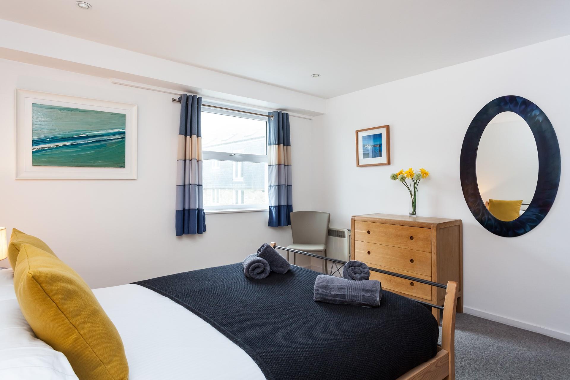 The stylishly decorated double bedroom provides you with a cosy base to rest your head.