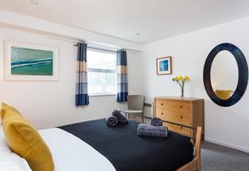 The stylishly decorated double bedroom provides you with a cosy base to rest your head.