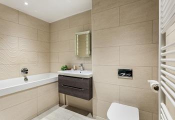 The bathroom boasts a relaxing, spa-like feel.