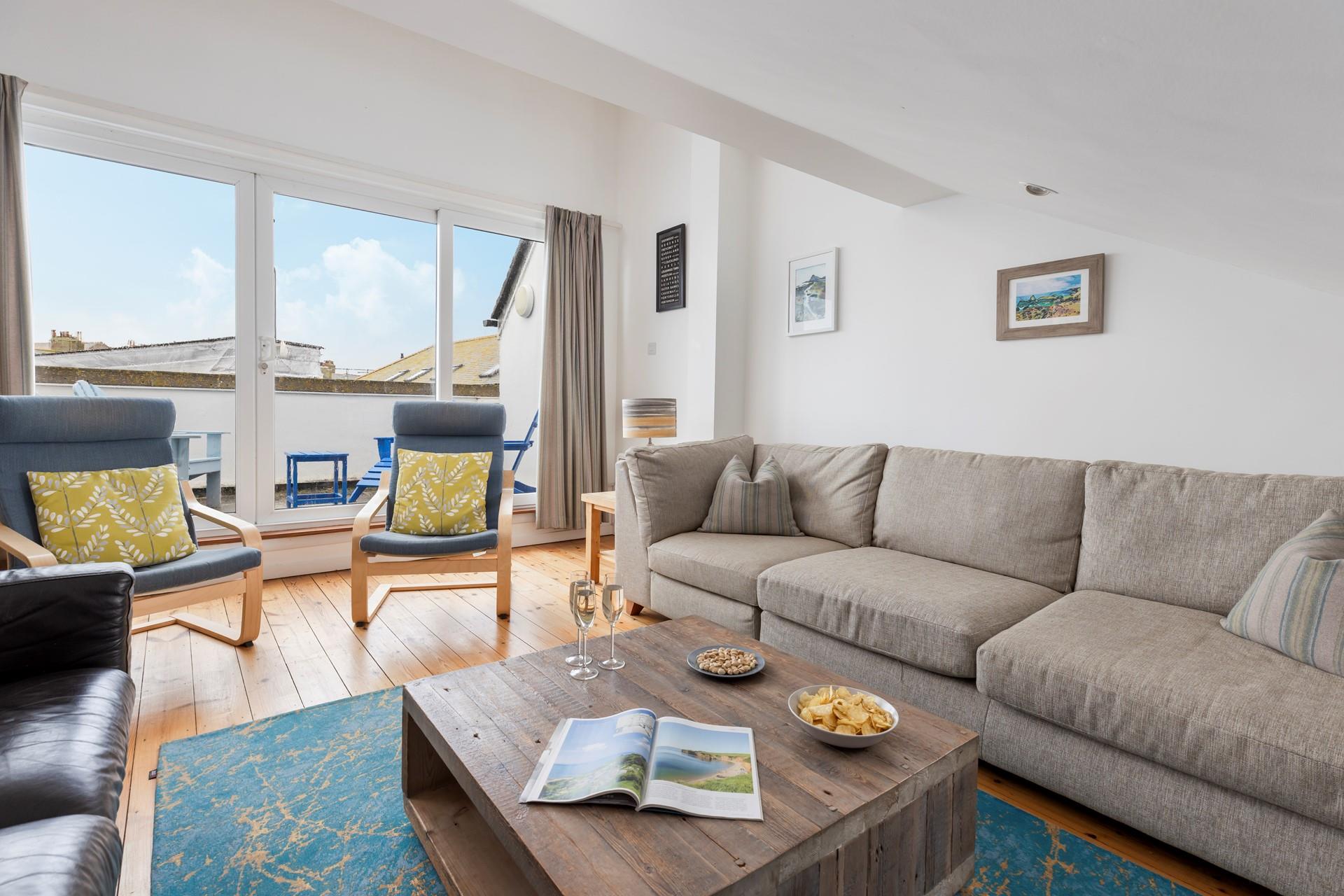 Spend evenings in the cosy sitting room after days on Porthmeor beach.