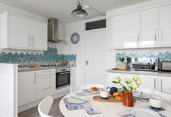 Though compact, the kitchen is fabulously well-equipped with modern appliances.