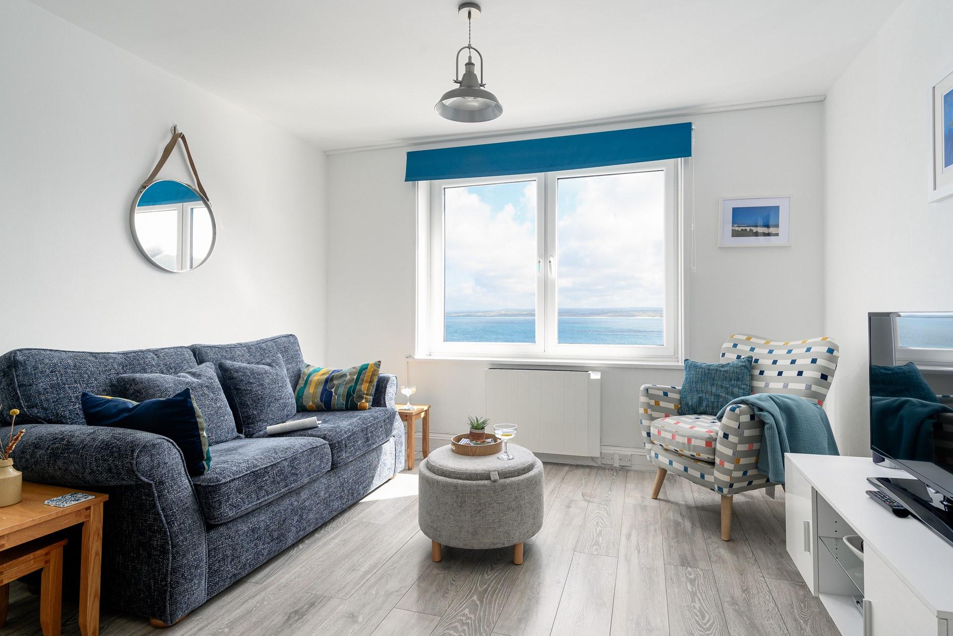 Sit and enjoy the stunning views from the sumptuous sofa.