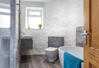 The bathroom is beautifully finished, perfect for relaxing after a day of coastal exploring.