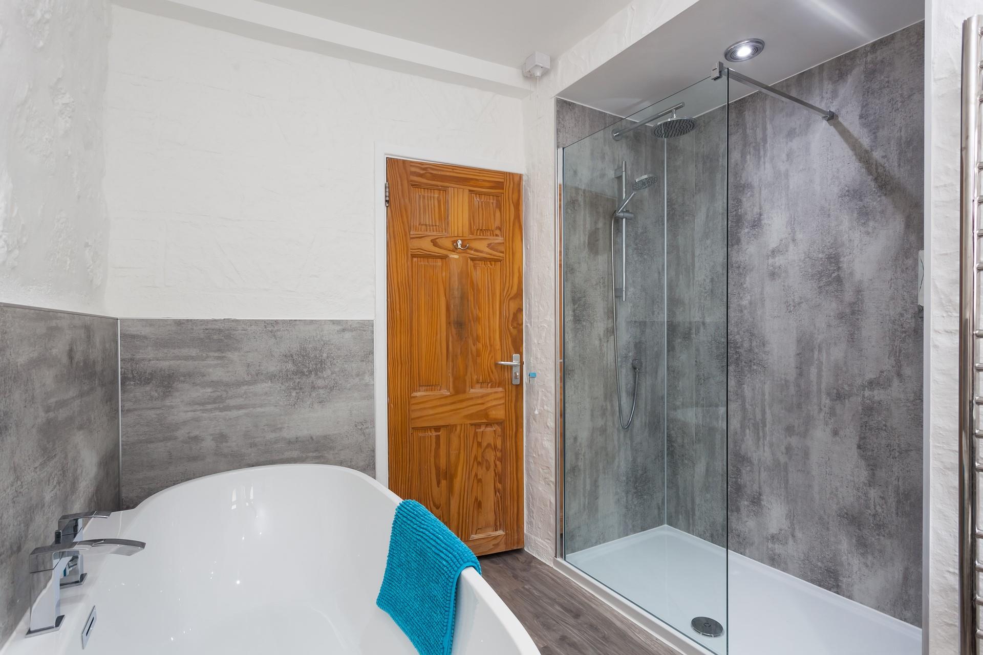 Wash off sandy toes in the rainfall shower or sink into the free-standing bath full of bubbles.