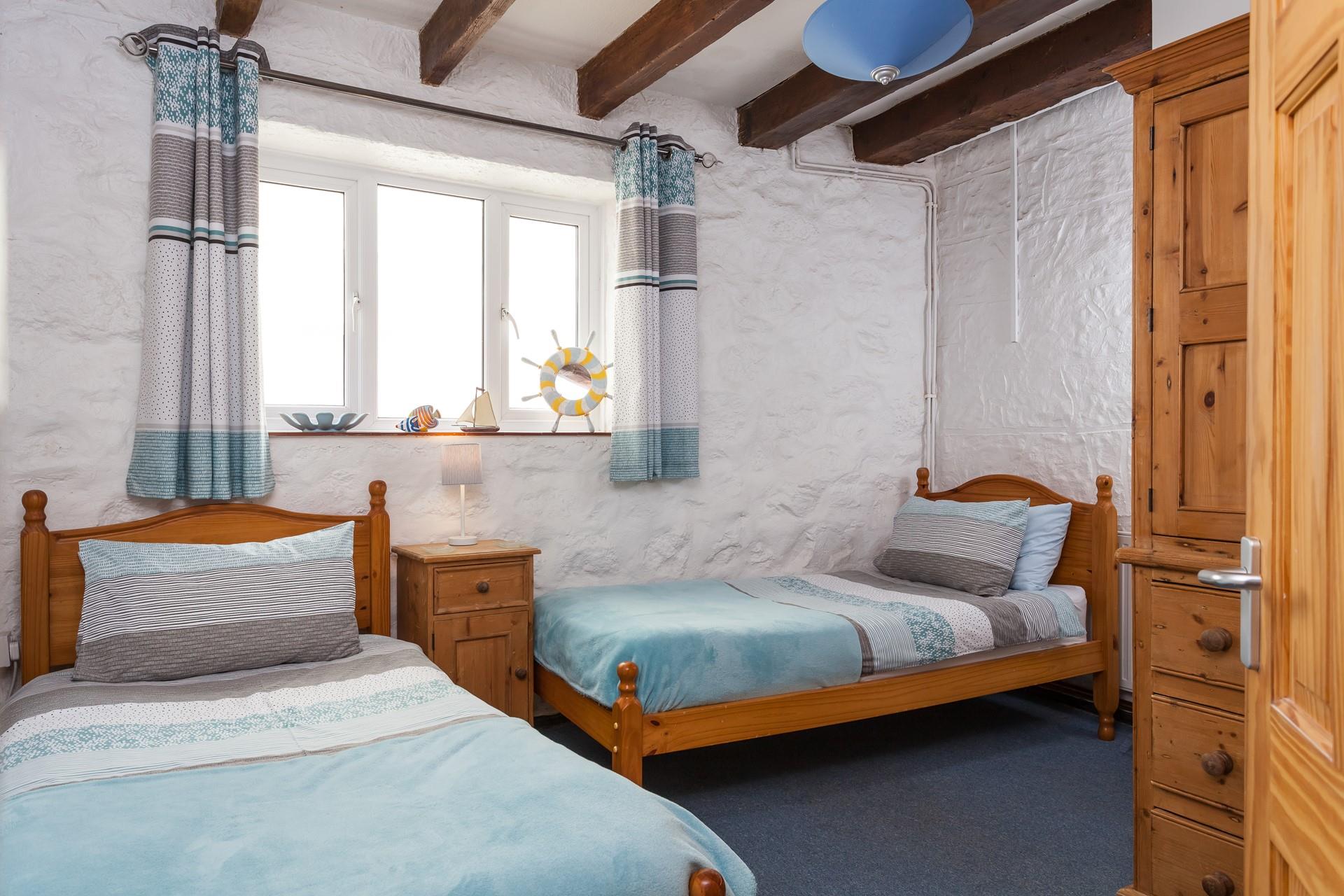 Bedroom 2 has comfortable twin beds.