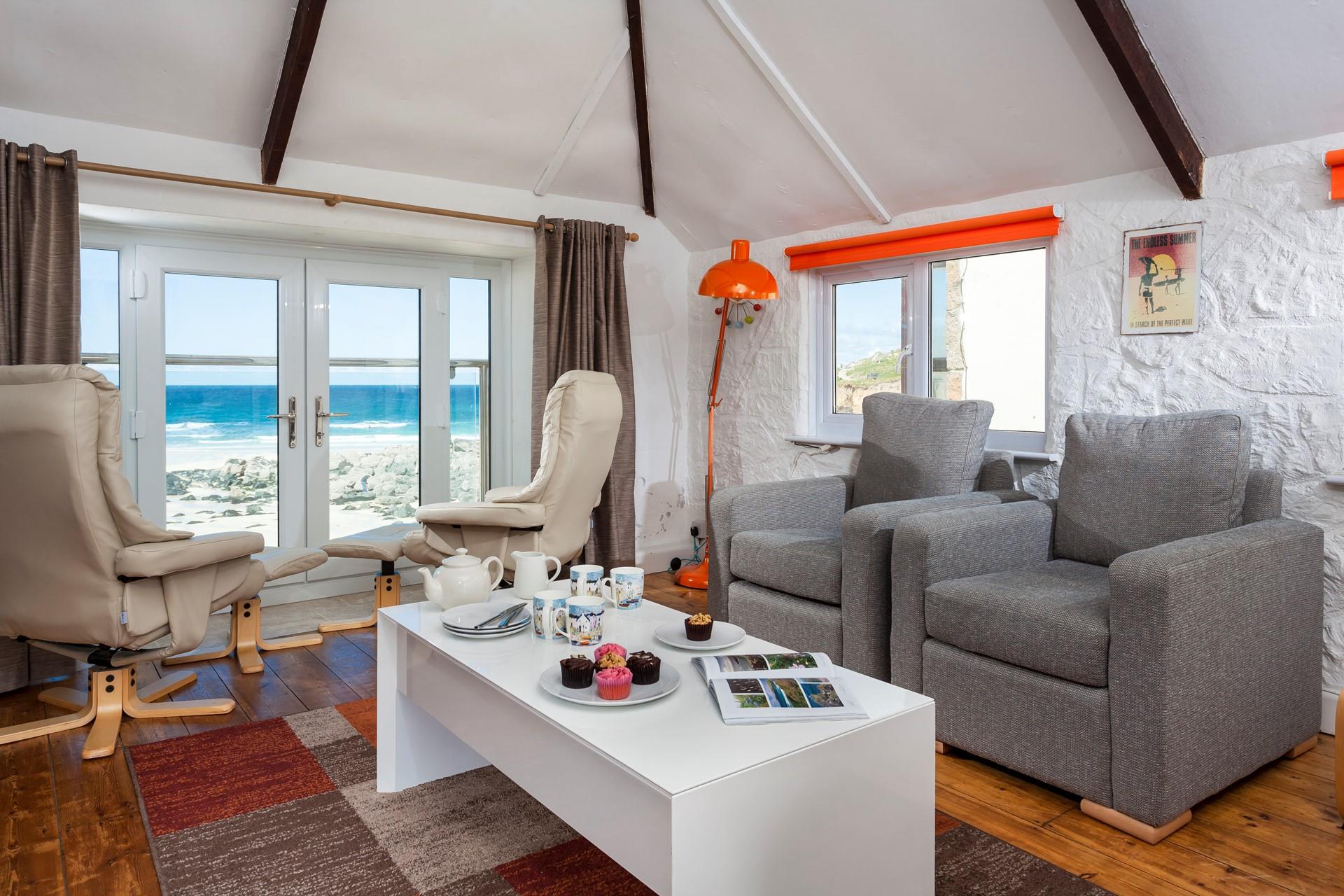 Sit back and put your feet up listening to the waves roll onto the beach.