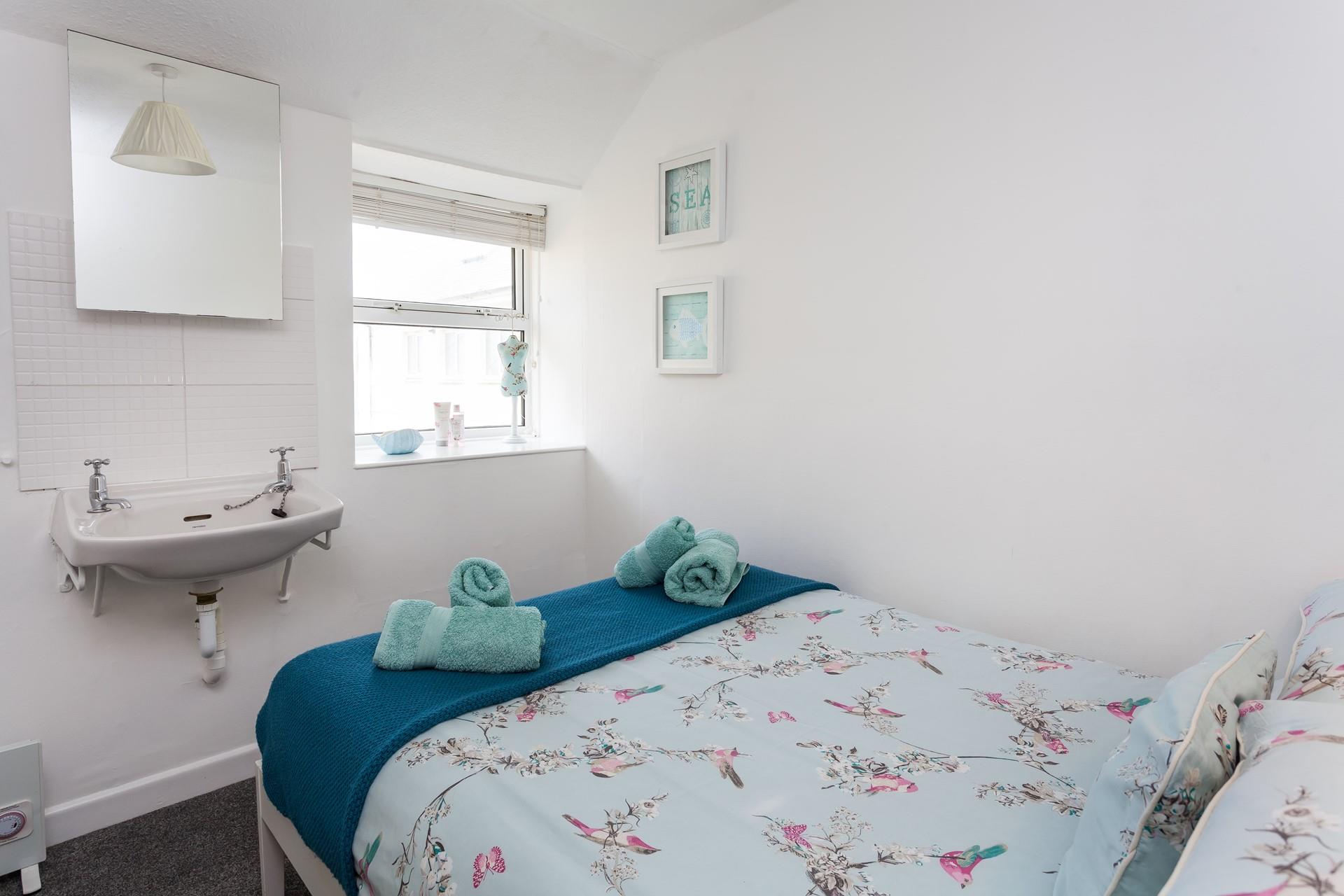 Bedroom 2 has a 4ft double bed and sea glimpses to wake up to.