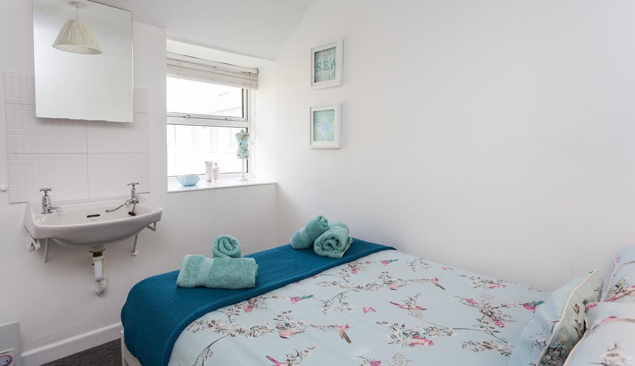 Bedroom 2 has a 4ft double bed and sea glimpses to wake up to.