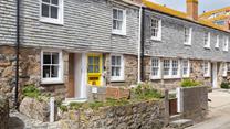 The cottage is on a quaint little street just steps from the shops in St Ives.