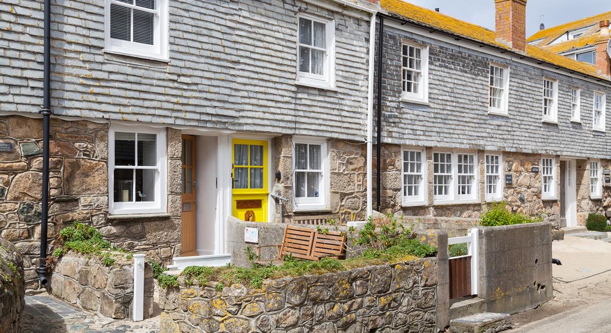 The cottage is on a quaint little street just steps from the shops in St Ives.