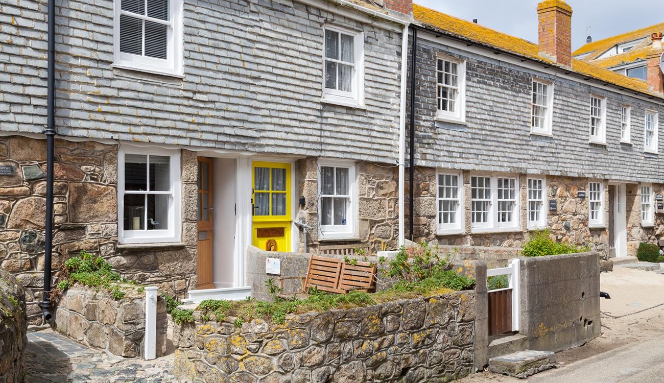 The cottage is on a quaint little street just steps from the shops in St Ives.