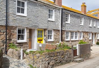 The cottage is on a quaint little street just steps from the shops in St Ives.