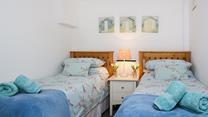Bedroom 3 has twin beds perfect for children or young adults.