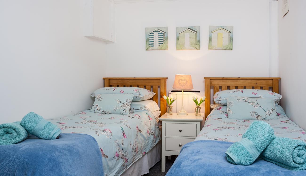 Bedroom 3 has twin beds perfect for children or young adults.