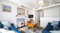 Light the electric fire and open a bottle of wine with a feel-good movie on the TV.