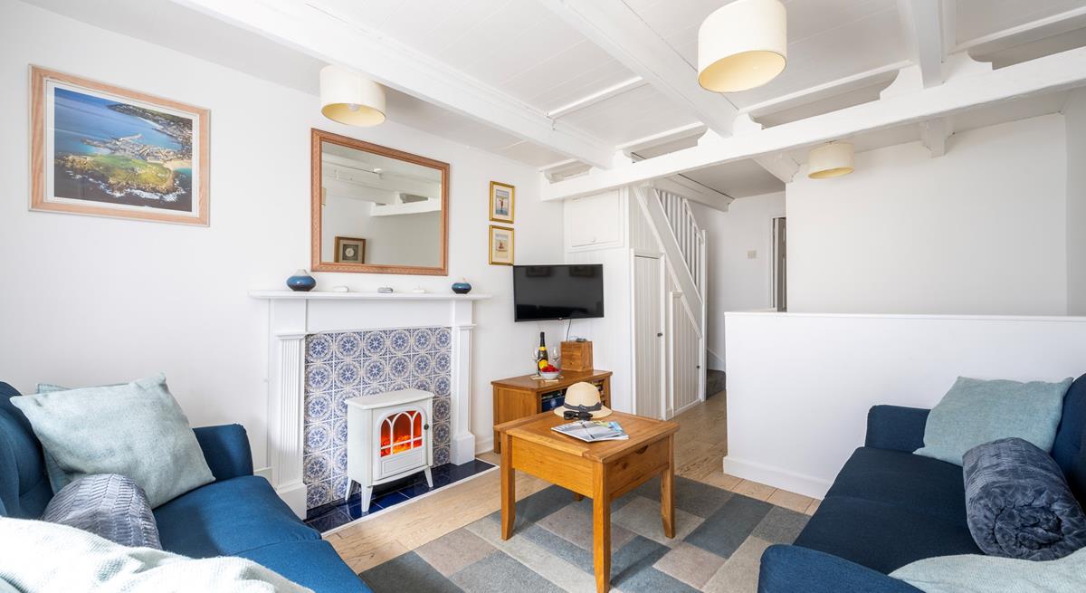 Light the electric fire and open a bottle of wine with a feel-good movie on the TV.