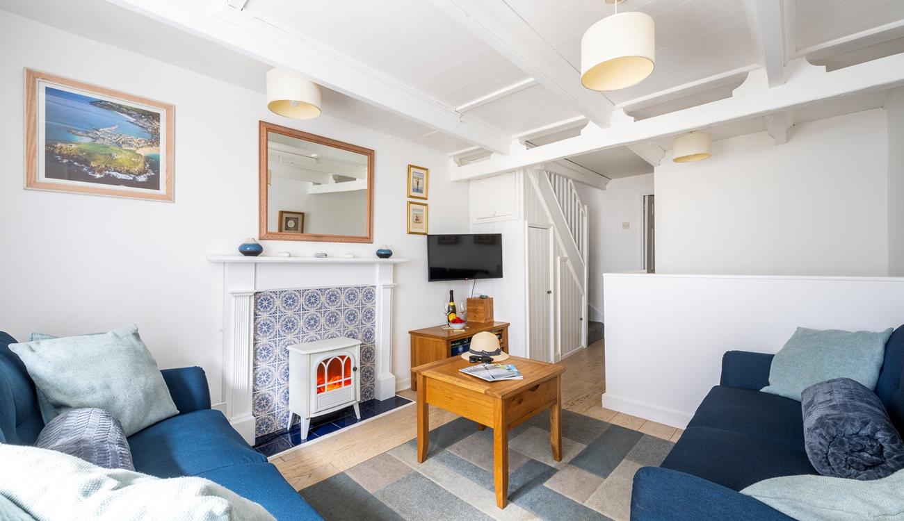 Light the electric fire and open a bottle of wine with a feel-good movie on the TV.