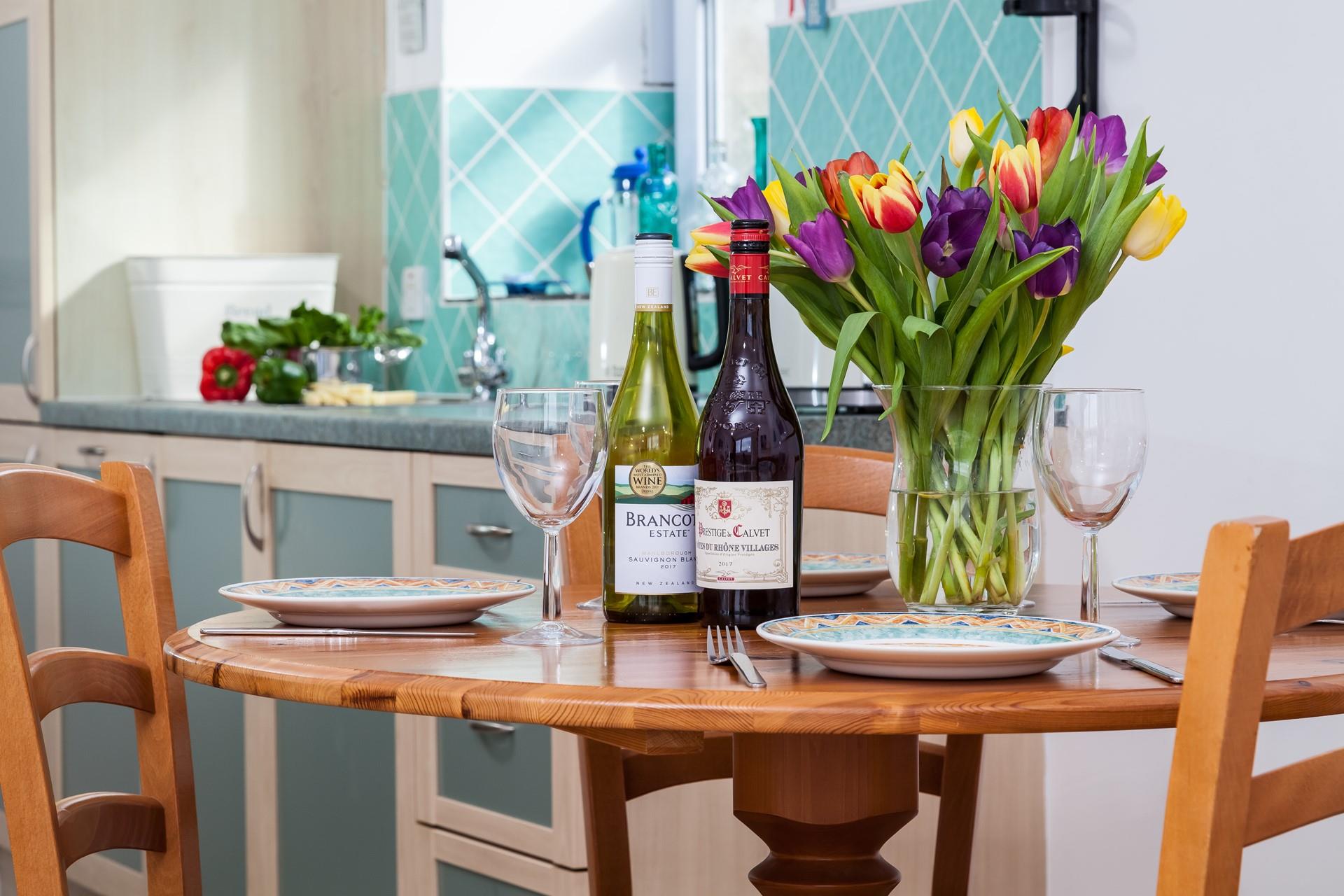Enjoy a glass of wine in the open plan dining area after spending the day on the beach.