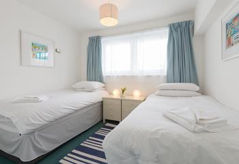 The twin bedroom is beautifully decorated and perfect for friends sharing.