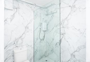 The bathroom has a fabulous sleek design, giving it a spa-like feel.