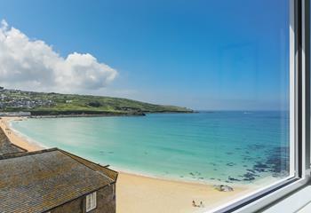 Large patio doors are perfect for letting in the fresh air and the sounds of the waves below.