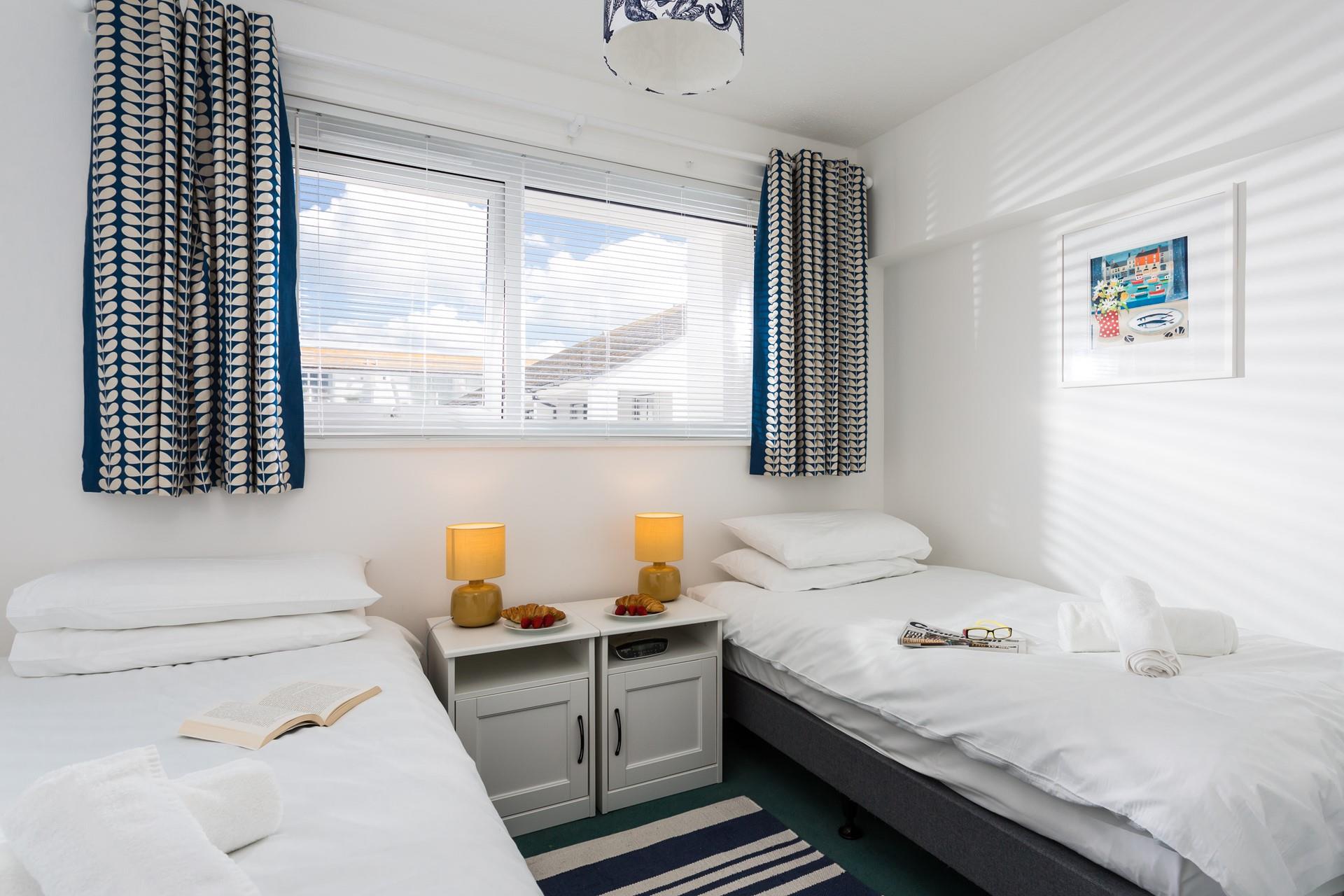 The twin bedroom is beautifully decorated and perfect for friends sharing.