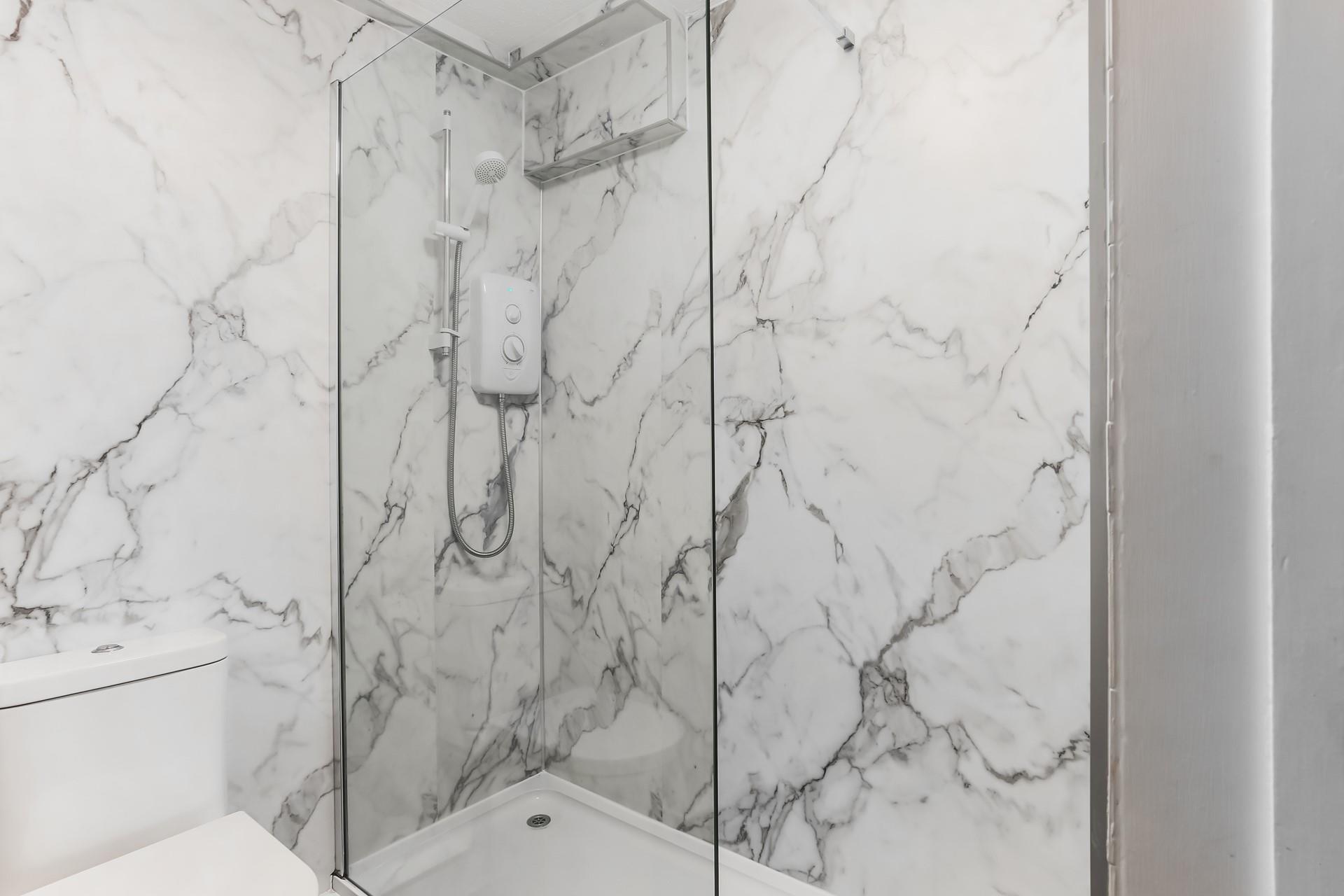 The bathroom has a fabulous sleek design, giving it a spa-like feel.