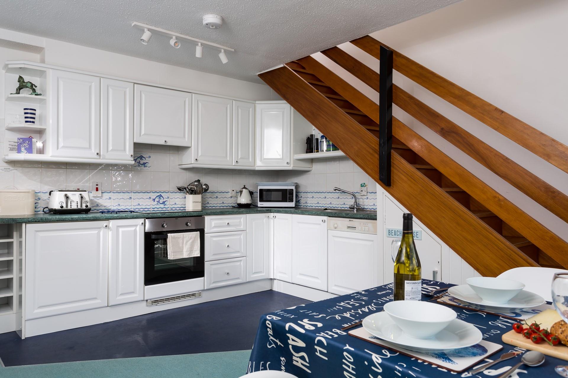 The open plan kitchen and dining area make it easy to socialise with your loved ones whilst cooking.