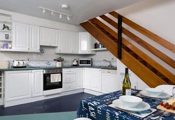 The open plan kitchen and dining area make it easy to socialise with your loved ones whilst cooking.