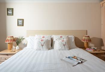 Crisp white linen and plump cushions make for a comfortable night's sleep. 