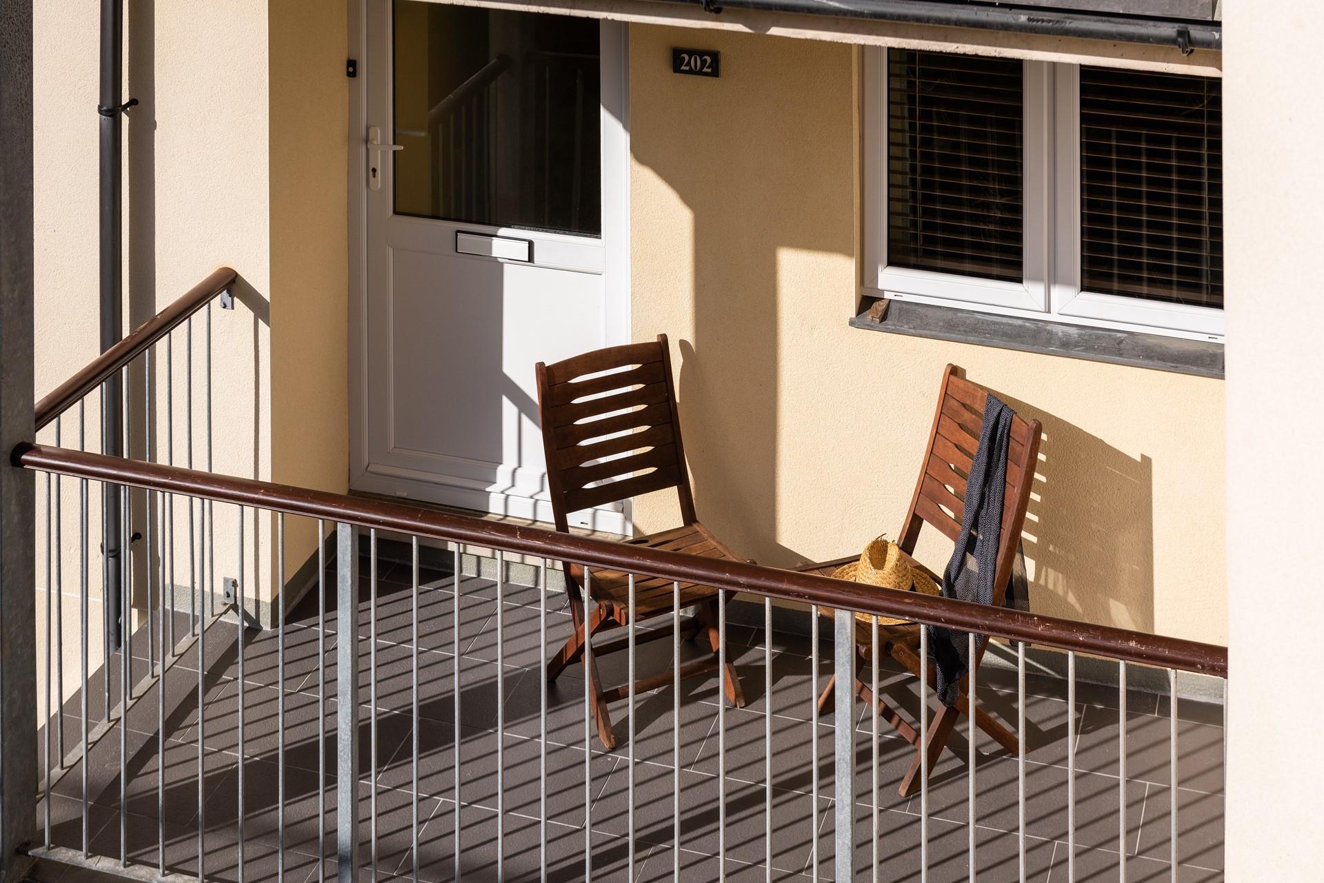 The rear balcony catches the last of the evening sunshine. 