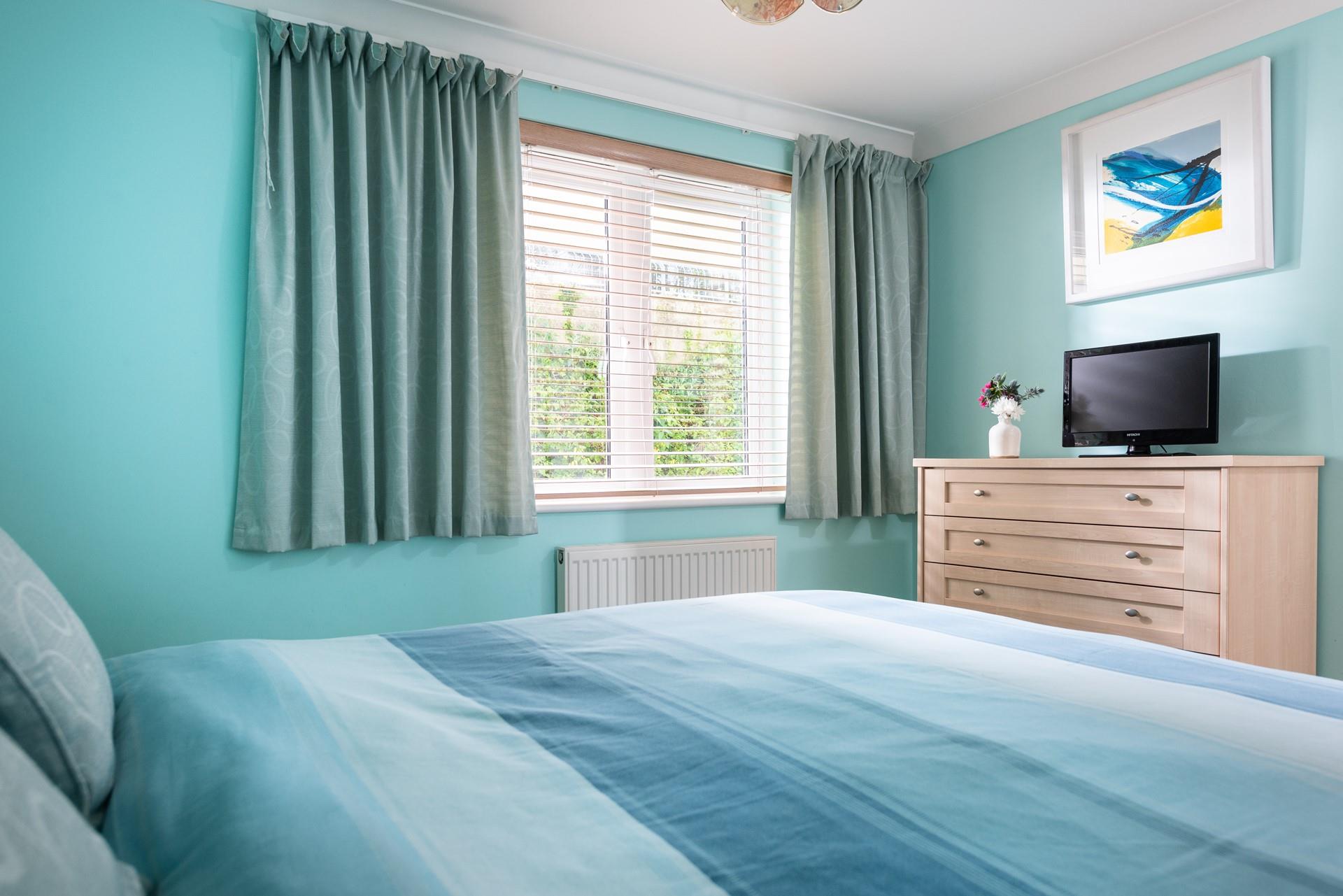 The light and airy bedroom 2 features zip and link beds which can be made up as twins or as a king size bed. 