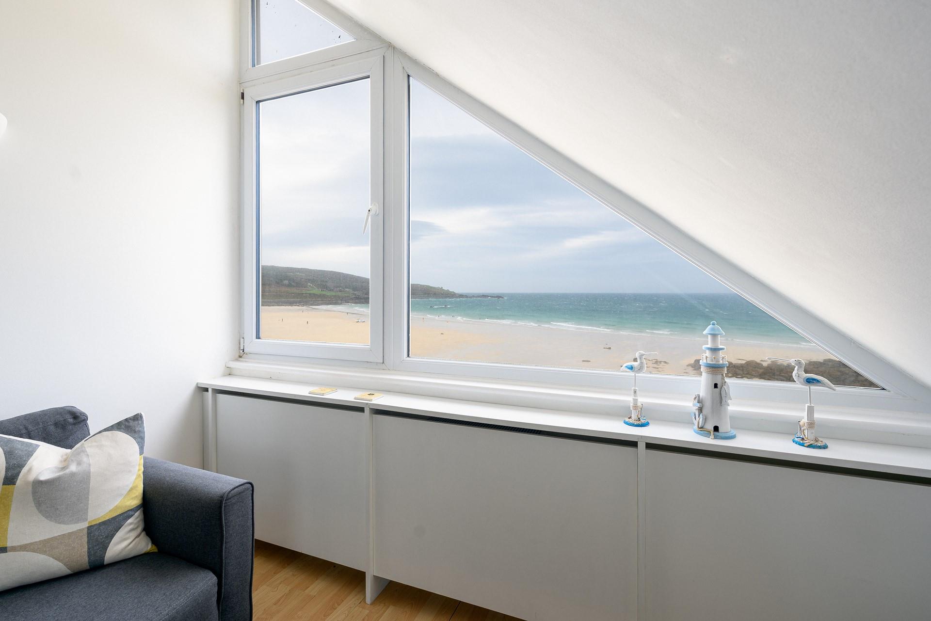 Watch the waves roll onto the beach from the comfort of the sitting room.
