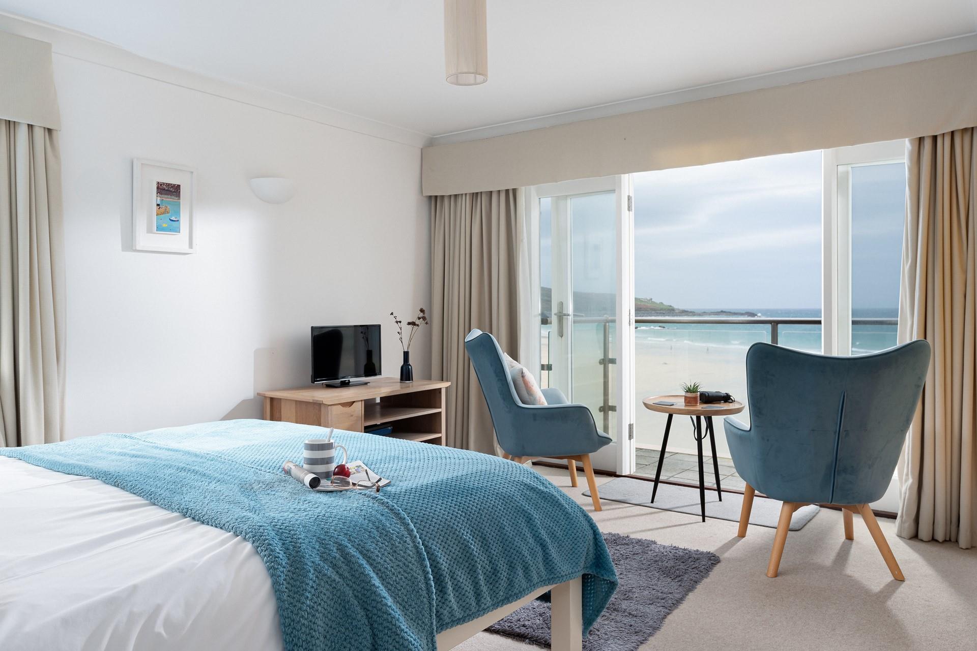 Spend lazy mornings gazing out at the waves rolling onto the golden sands of Porthmeor.