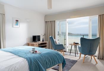 Spend lazy mornings gazing out at the waves rolling onto the golden sands of Porthmeor.