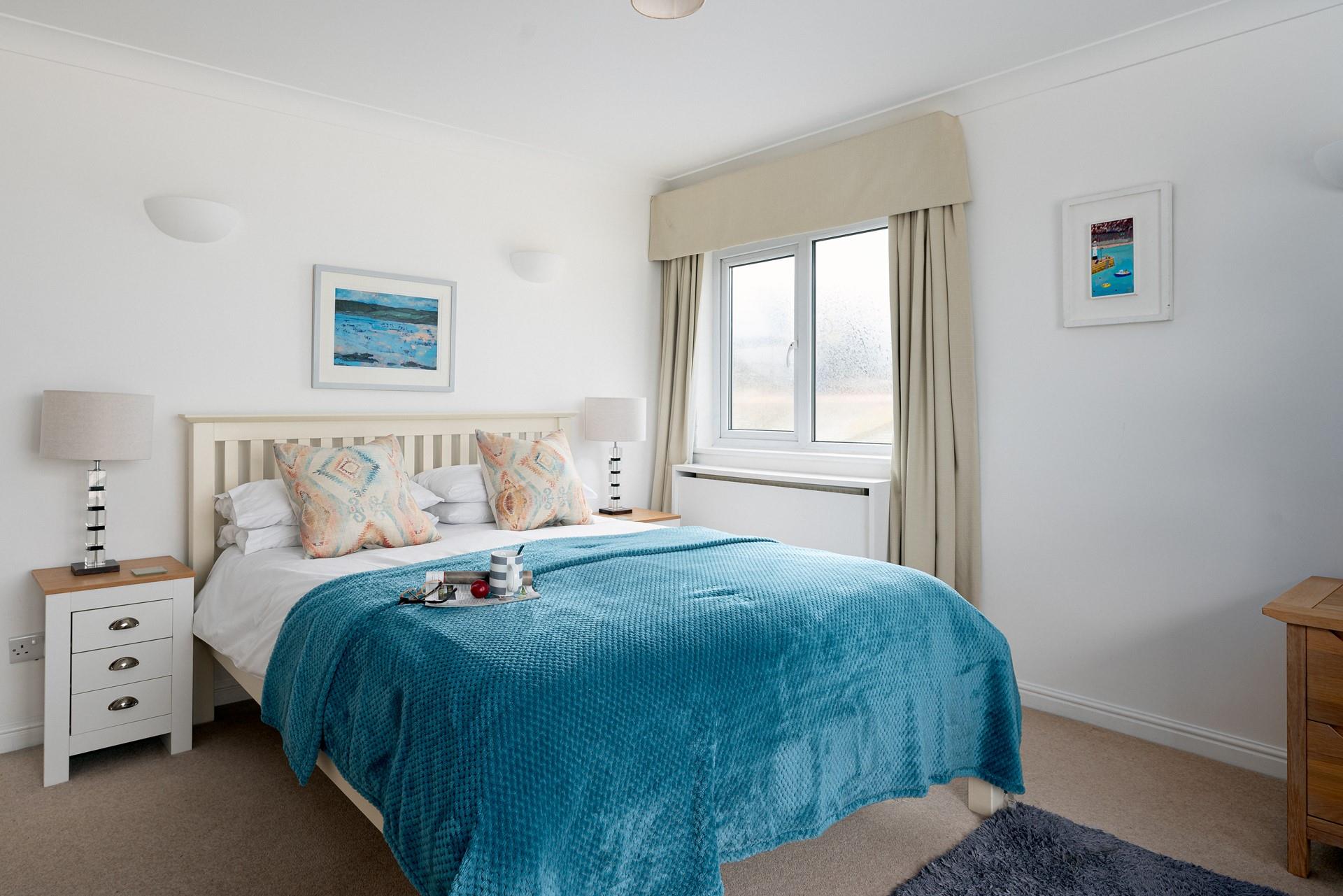 Snuggle down in your cosy double bed after a busy day swimming in the Cornish seas.