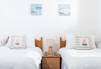 We love the adorable nautical design in the twin bedroom!