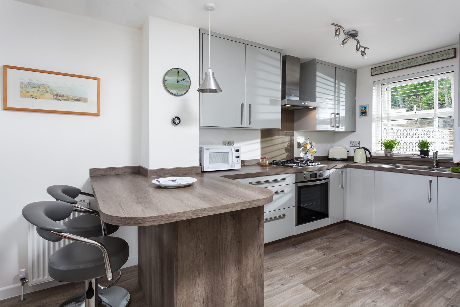 The kitchen is well-equipped with modern appliances that make cooking a breeze.