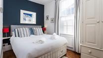 The bedrooms gorgeous nautical design reminds you just how close to the seaside you are!