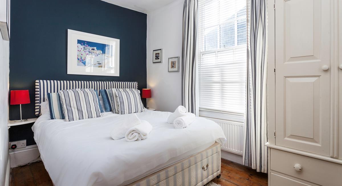 The bedrooms gorgeous nautical design reminds you just how close to the seaside you are!