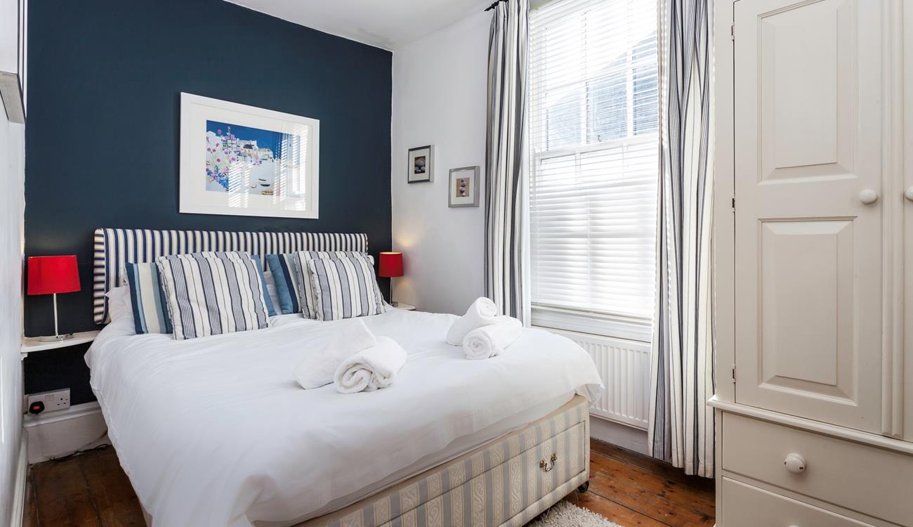 The bedrooms gorgeous nautical design reminds you just how close to the seaside you are!